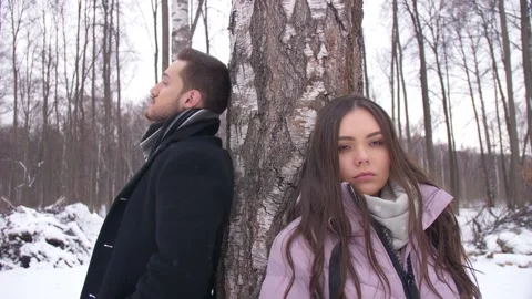 A Guy and a Girl Leaned on a Tree Stock Footage 163466586