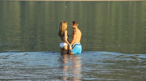 Guy and girl on the river Stock Footage 66753047