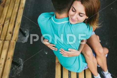 Guy and the girl sitting on a bench Stock Photos
