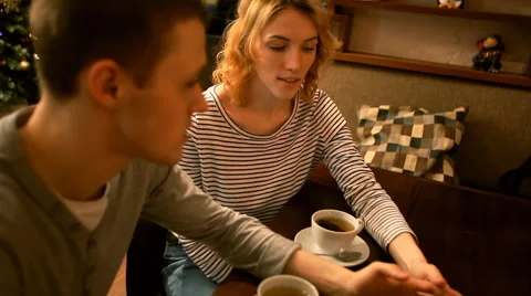 A guy and a girl sitting at the table. Stock Footage 59222328