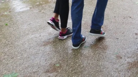 A guy and a girl walking down the street Stock Footage 71453914