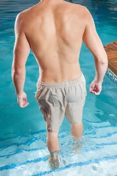 Guy back enter the pool 写真素材