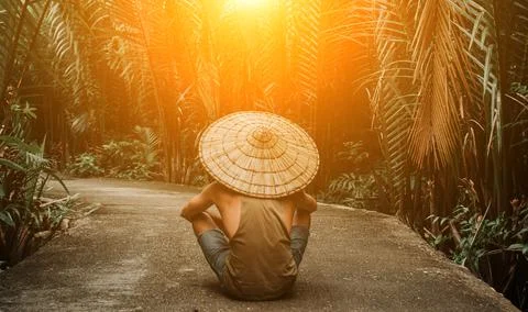 A guy on the background of the jungle. in a hat, on order. Stock Photos