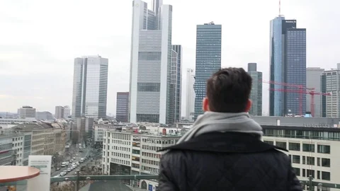 The guy in the background of skyscrapers Stock Footage 128439516