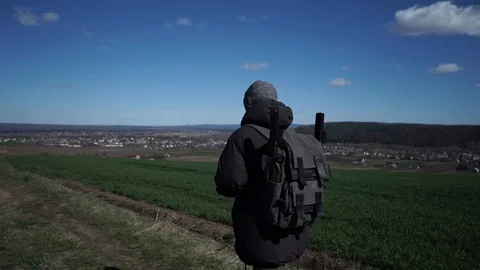 The guy with the backpack on his shoulders goes to his destination Stock Footage 126358927