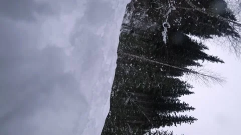 A guy with a backpack walks along a snowy trail Stock Footage 225848555