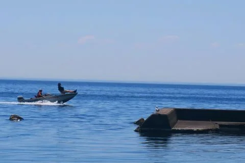 Guy balacing on a boat Stock Photos