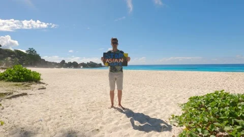 The guy on the beach against the background of the ocean Stock Footage 155797776