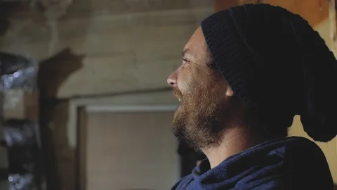 The guy with the beard and mustache in the hat laughs.stylish hipster Stock Footage 102941976