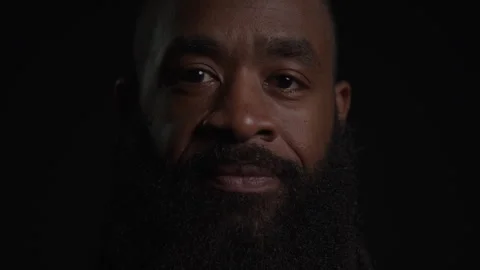 Guy With Beard In Dark Room Looking Video stock 270397162