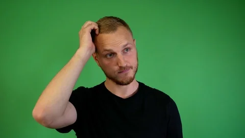 A guy with a beard doubts Video stock 115237798