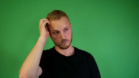 Guy with a beard doubts Stock Footage 115238845