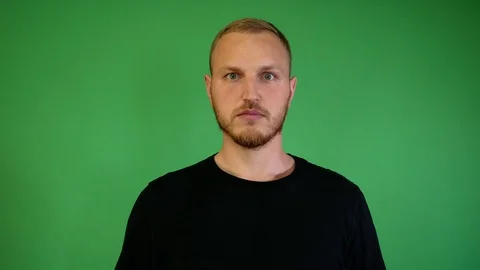 Guy with a beard surprised on a chroma key Stock Footage 115237466