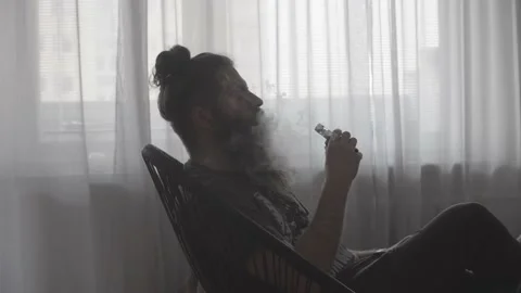 Guy with beard vaping Stock Footage 149245916