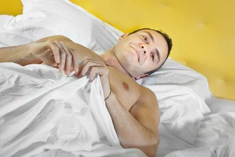 Guy in bed Stock Photos