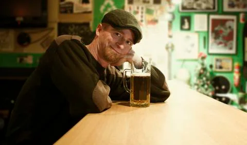 Guy with beer in the bar Stock Photos