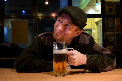 Guy with beer in the bar Stock Photos