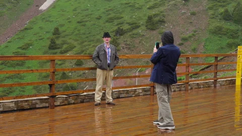 Guy in a black hat, mountains Stock Footage 296239363