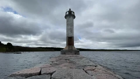 A guy in a black jacket is sad and looks into the distance next to the sea light Stock-Footage 205833015