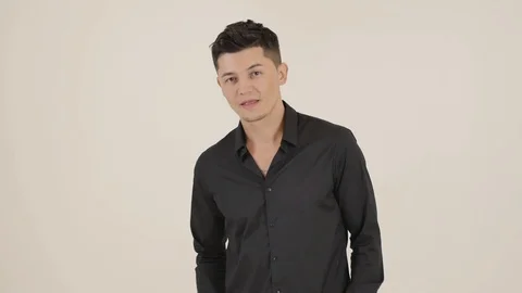 Guy in a Black shirt Faces his Camera Stock Footage 87975173