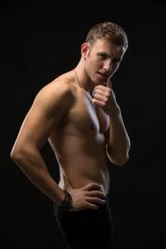 Guy in a black studio Fotos de archivo