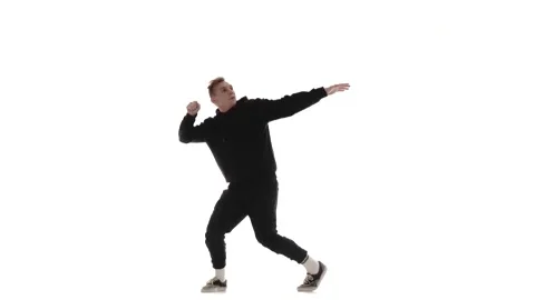 Guy in black tracksuit dancing hip hop, freestyle, street dance, isolated Stock Footage 130376732