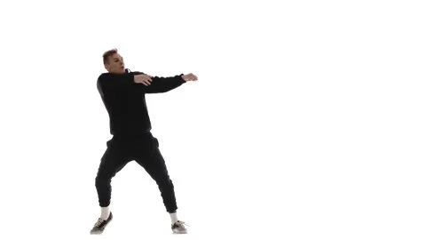 Guy in black tracksuit dancing hip hop, freestyle, street dance, isolated Stock Footage 130376738