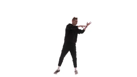 Guy in black tracksuit dancing hip hop, freestyle, street dance, isolated Stock Footage 130382656