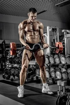 Guy bodybuilder with barbell Stock Photos