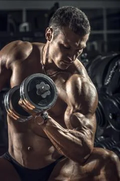 Guy bodybuilder with dumbbell Stock Photos