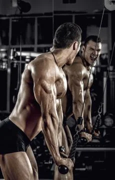 Guy bodybuilder with dumbbell Stock Photos