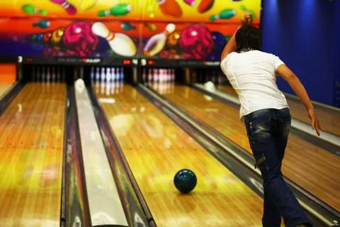 The guy is bowling. Rear view. Stock Photos