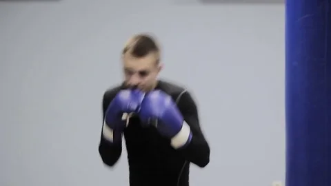 Guy boxer trains in the gym Stock-Footage 83034859