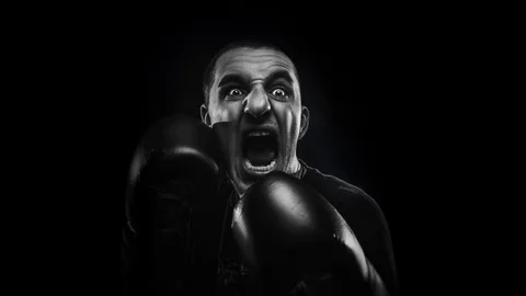 Guy in Boxing gloves screaming with fear Stock Footage 87446997