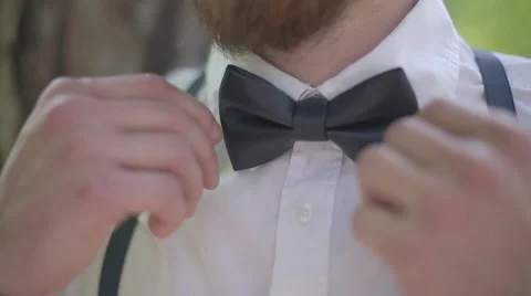 A guy with a bread corrects tie Stock Footage 61248092