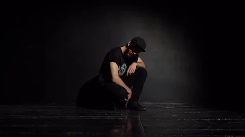 Guy breakdancer looks at the camera and jumps forward Stock Footage 82546449