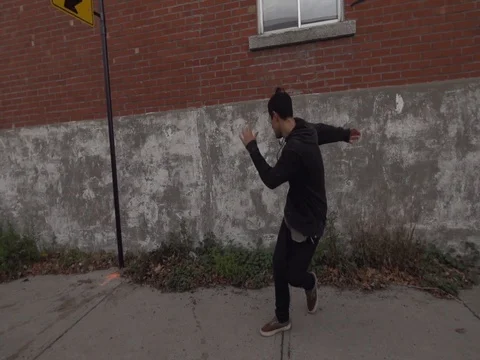 Guy Breakdancing on Side Walk Urban Streets in Slow Motion Stock Footage 80164596