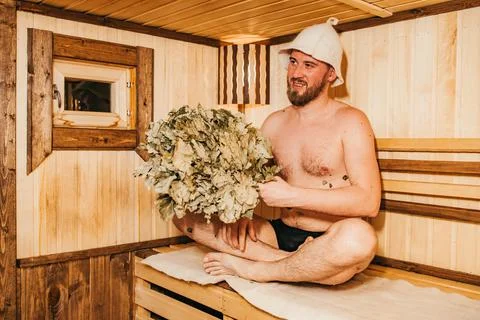 The guy with a broom is resting in the bath Stock Photos