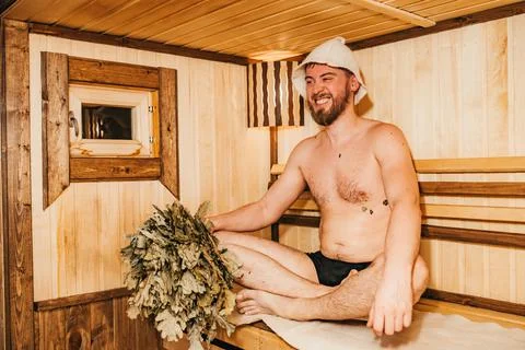 The guy with a broom is resting in the bath Stock Photos