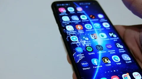 Guy browsing on a smartphone amazon prime video app catalog,streaming platform Stock Footage 128502006