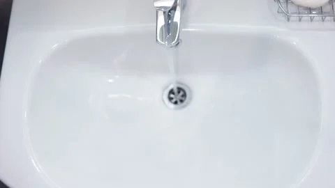 The guy is brushing his teeth. View from above. Stockbeeldmateriaal 151920366