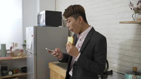 Guy in business suit carrying bread Stock Footage 157524430