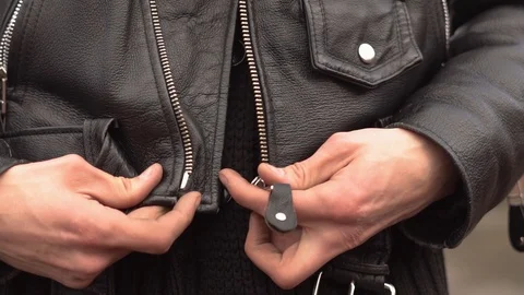 Guy buttoning his jacket Stock Footage 88991987