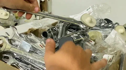 Guy buys a spanner tool in the household Wrench in the hands close-up. Tool shop Stock Footage 204972850