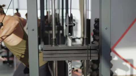 Guy in cable machine Stock Footage 118074440