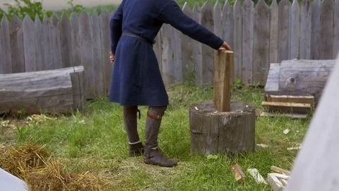 Guy can not put a firewood exactly Stock Footage 82404104