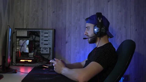 The guy carefully plays computer games with a joystick Stock Footage 149219202