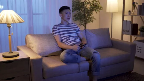 Guy changing tv channels found stand-up comedy Video stock 133698445