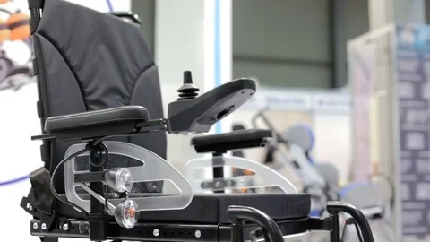 The guy chooses a wheelchair 스톡 동영상 75473114