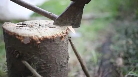 A guy chopping firewood with an ax. Stock Footage 132108557
